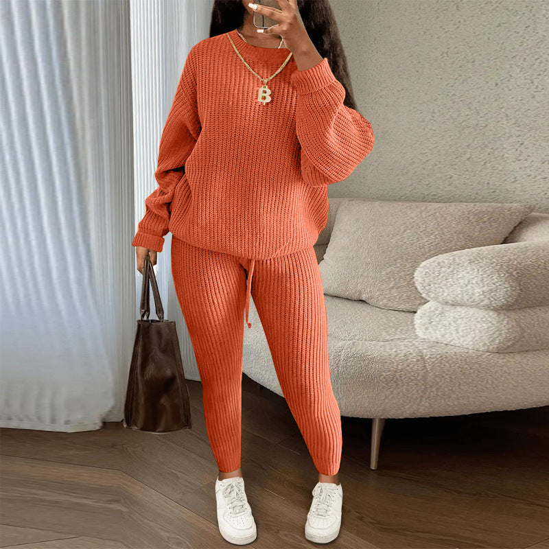 Woman in matching ribbed knit sweater and pants set