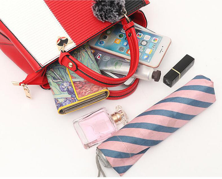 Colorblock handbag with pom-pom charm