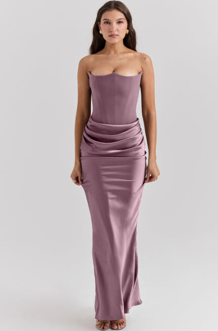 Woman in a strapless satin maxi gown