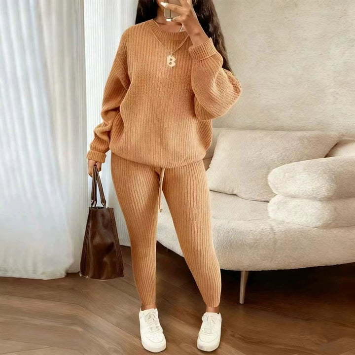 Woman in matching ribbed knit sweater and pants set